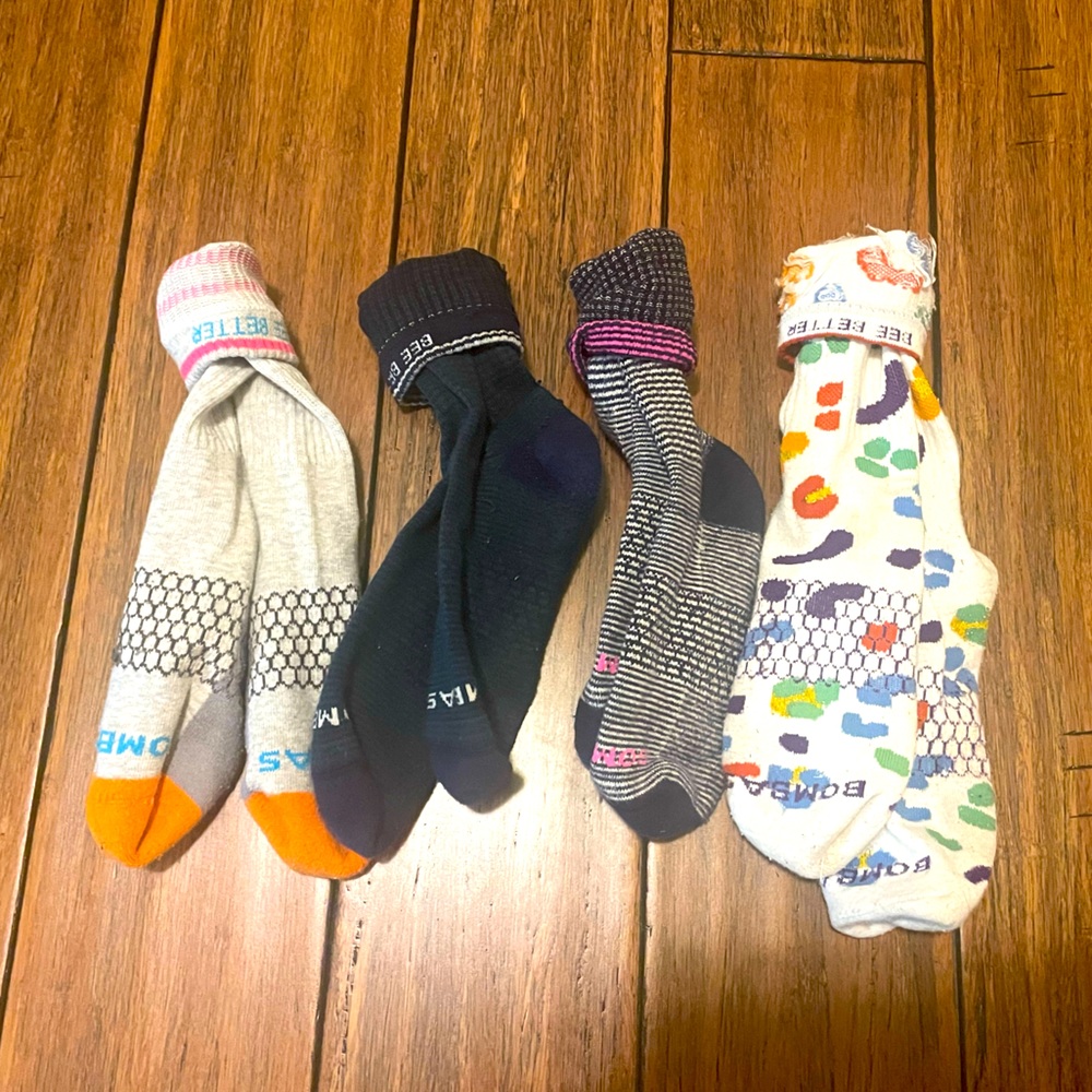 Four pairs of hood condition Bombas Socks